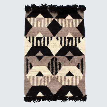 Minimalist wall art rug featuring bold geometric pattern